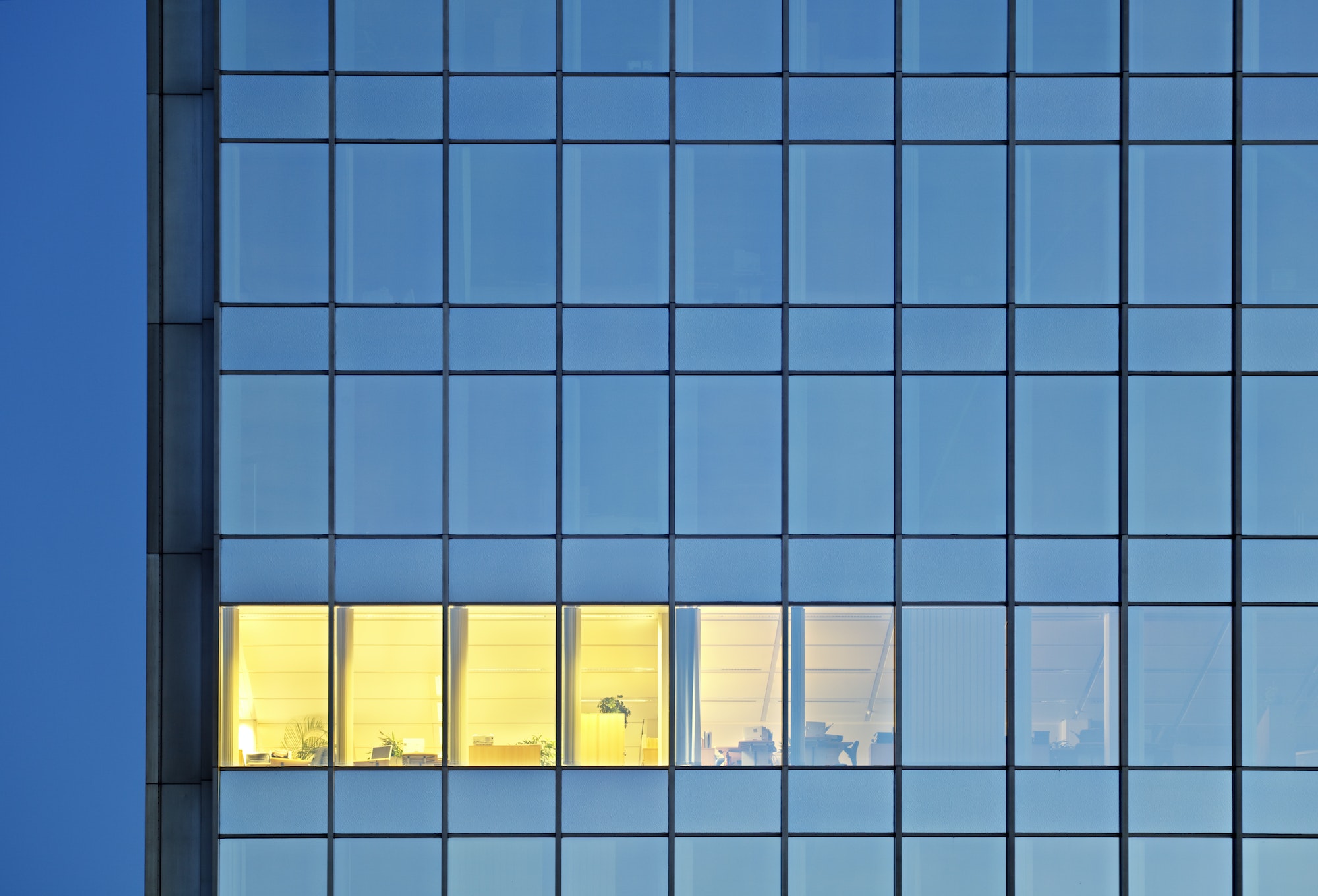 Lonely Illuminated Room In An Office Tower